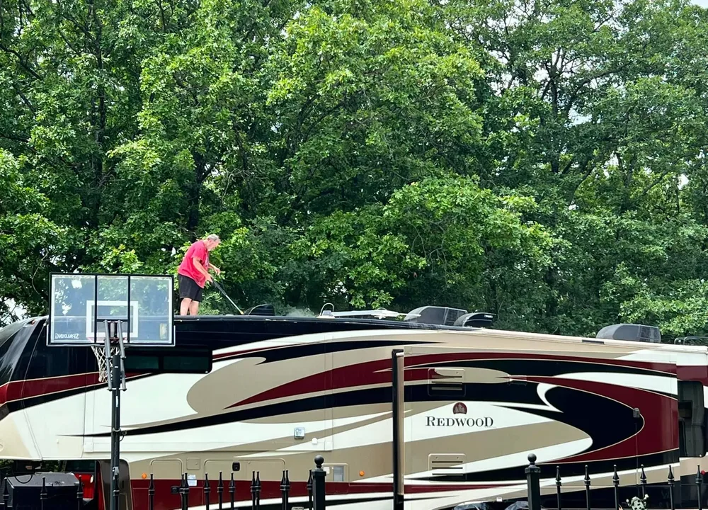 Mobile RV Detailers service setup beside an RV